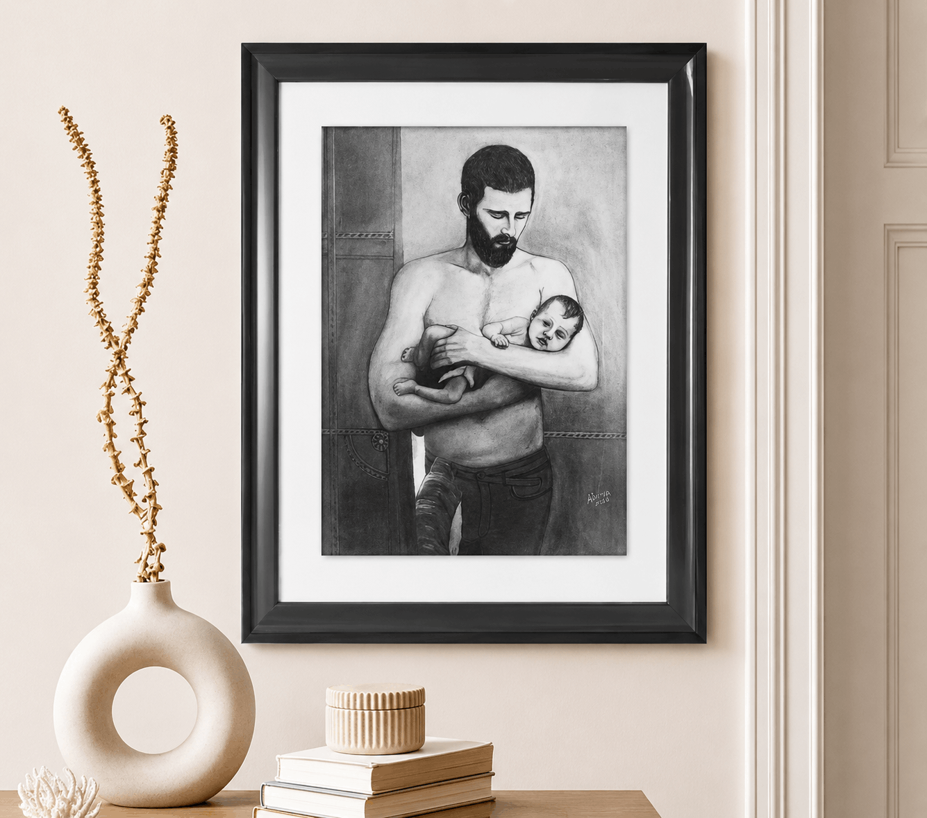 Charcoal drawing of a bearded father standing in a doorway holding his sleeping baby across his forearms