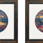 Pair of circular abstract paintings in teal, magenta and gold, framed in dark wood with white circular mounts