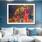 Photograph of priests at the Ganga Aarti in Varanasi sweeping chamars over brass lamp stands before a crowd at night