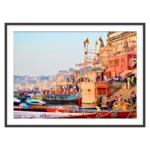 Varanasi ghats with colorful boats and historic riverside buildings along the Ganges