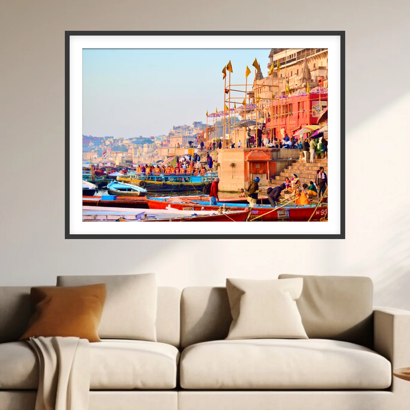 Varanasi ghats with colorful boats and historic riverside buildings along the Ganges